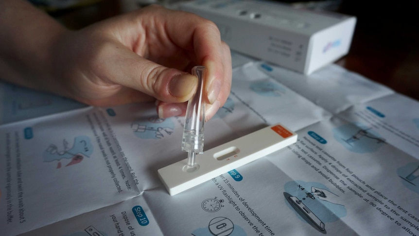 A sample from a COVID rapid antigen test is applied to a cassette