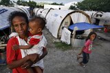 An East Timorese woman and child await peace in one of many refugee camps in East Timor, April 2007.