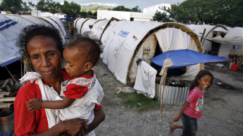 An East Timorese woman and child await peace in one of many refugee camps in East Timor, April 2007.