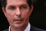 A close-up of WA Greens senator Scott Ludlam's face as he speaks during a media conference.