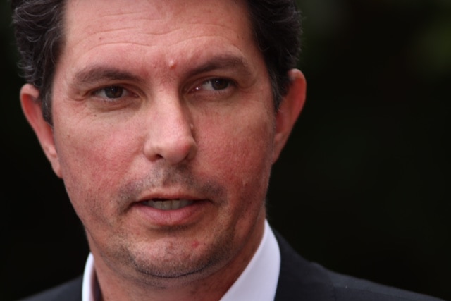 A close-up of WA Greens senator Scott Ludlam's face as he speaks during a media conference.