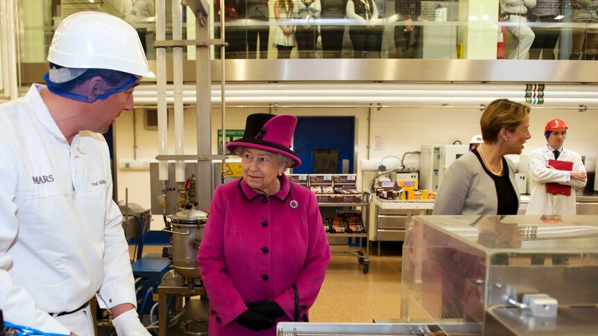 Queen Elizabeth during tour of Mars Chocolate Factory