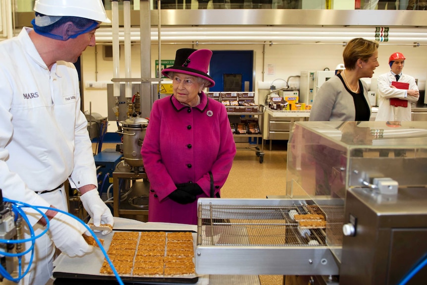 Queen Elizabeth during tour of Mars Chocolate Factory