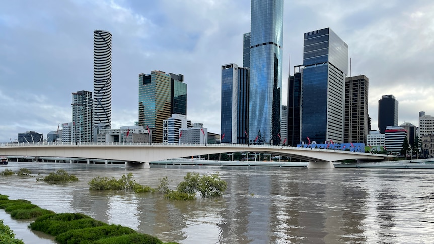 Flooding in front of large tall buildings