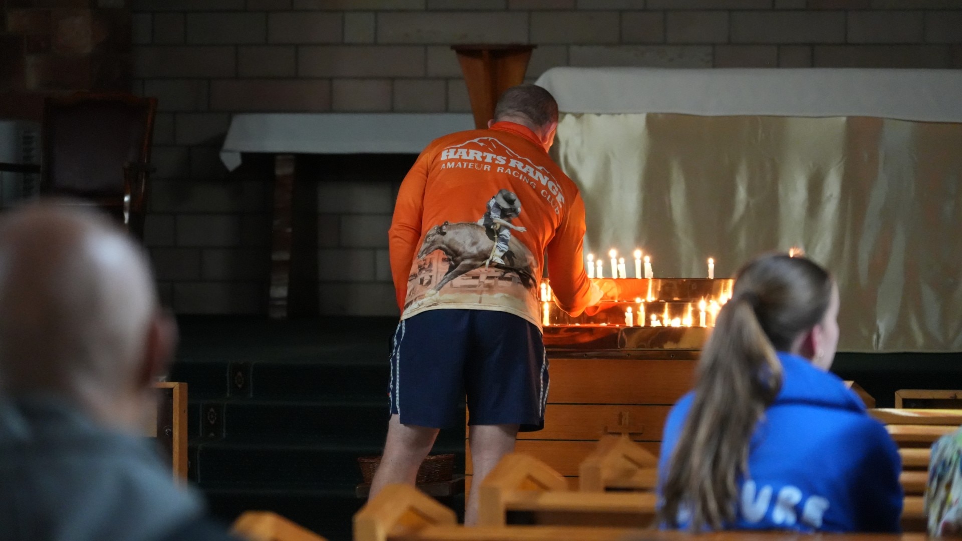 a man lighting a candle. 