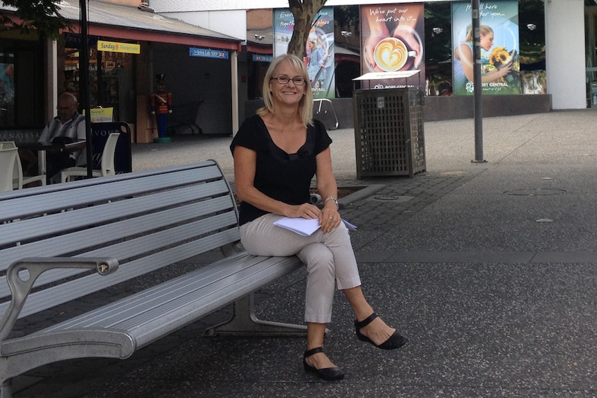 Pacific Coast Shopping Centres' Ann-Maree Crowe sits on a bench in the courtyard where the weekly farmers' market will be held.
