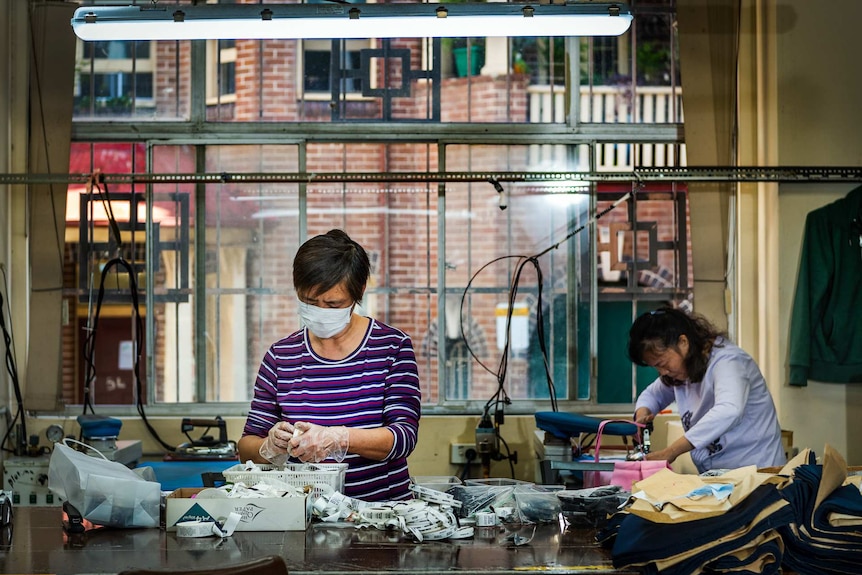 Workers sewing in a factory in Chippendale, Sydney.
