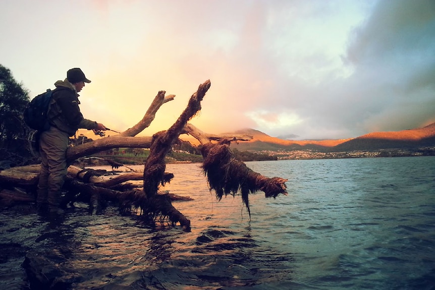 Fisherman Plinio Taurian casts a line