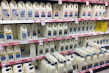 milk on shelves in the supermarket