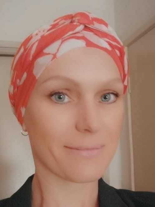 A woman wearing a head scarf