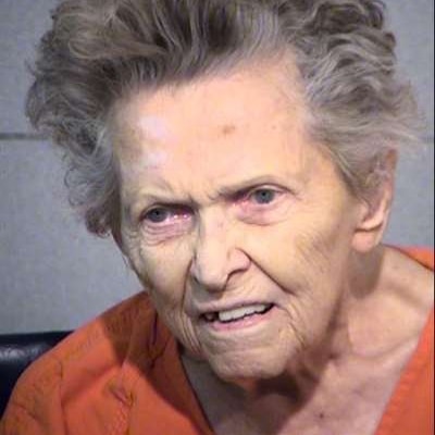 Mugshot of Anna Mae Blessing. She has grey hair and appears to be wearing an orange prison jumpsuit.