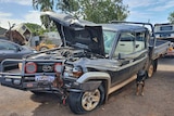 The wreckage of a brand-new Toyota Landcruiser ute after it was stolen in Kununurra.