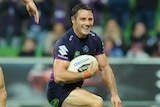 Cooper Cronk celebrates scoring a try against Penrith