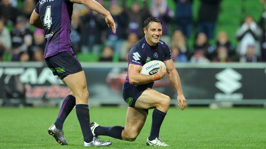 Cooper Cronk celebrates scoring a try against Penrith