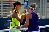 Vitalia Diatchenko of Russia shakes hands with Timea Bacsinszky of Switzerland after their first round Women's Singles match on Day Two of the 2016 US Open