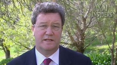 Outraged: Mr Downer says no officials are involved in the kickbacks. [File photo]