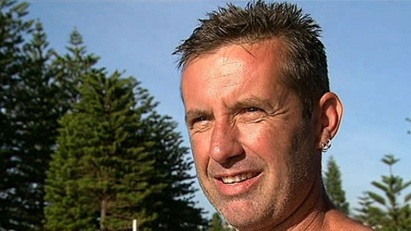 Paul Welsh was attacked by a wobbegong while teaching his 10-year-old son to surf.