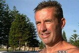 Paul Welsh was attacked by a wobbegong while teaching his 10-year-old son to surf.