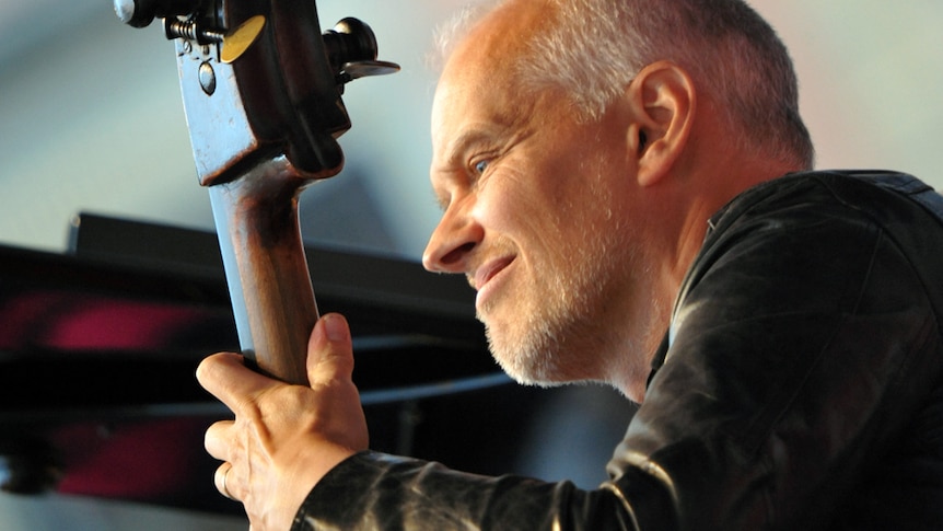 A tight-cropped photo of Lars Danielsson performing on his double bass