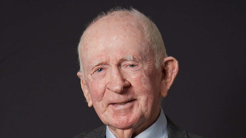 Portrait of an elderly man wearing war medals