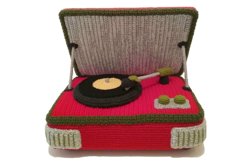 A crocheted red record player.