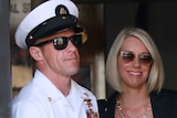 Gallagher walks out of military court with his wife Andrea.