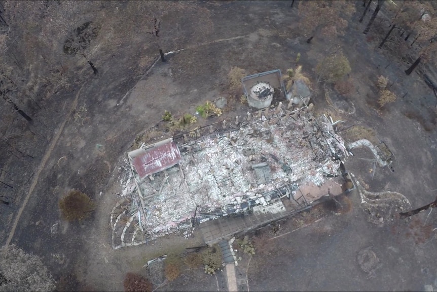 An aerial shot of a house destroyed by fire