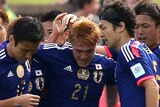 Japan celebrates goal against Palestine