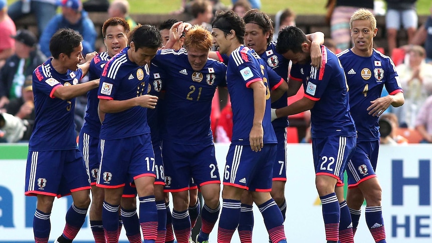 Japan celebrates goal against Palestine