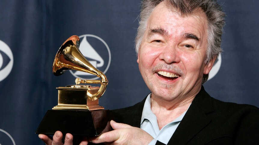 John Prine with his Grammy Award.