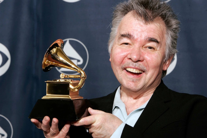 John Prine with his Grammy Award.