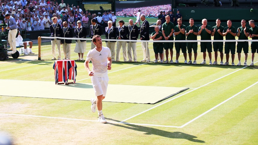 Andy Murray of Great Britain runs across the court to celebrate following his Wimbledon win.