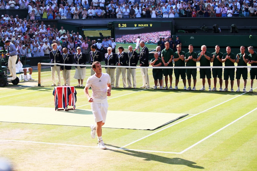 Andy Murray of Great Britain runs across the court to celebrate following his Wimbledon win.