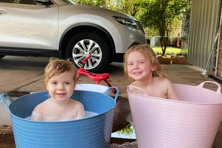 kids in buckets of water