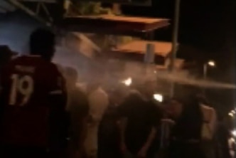 Police pepper spray a Darwin crowd on Mitchell Street