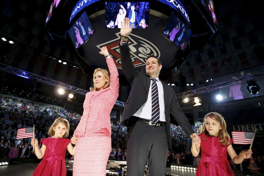 US Senator Ted Cruz stands on stage with his wife Heidi and their daughters Catherine and Caroline