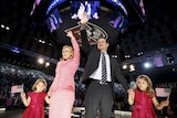 US Senator Ted Cruz stands on stage with his wife Heidi and their daughters Catherine and Caroline