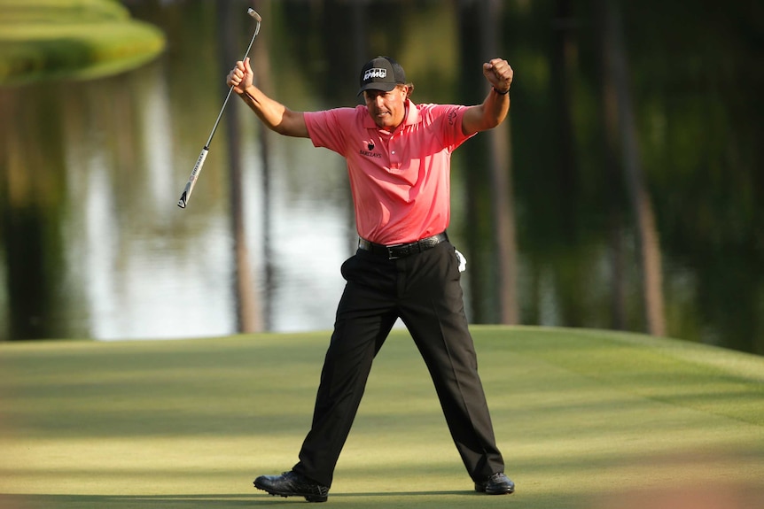 Phil Mickelson celebrates in the third round of the Masters