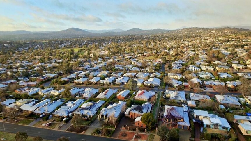 Snow-topped homes in Canberra this morning.