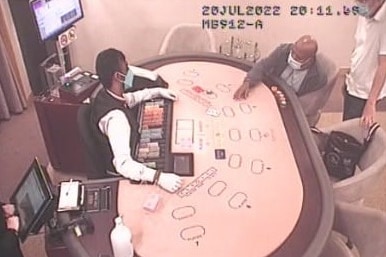 Lukas Enembe at a gambling table at a casino in the Genting Highlands in Malaysia. 