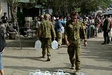 Soldiers deliver water in Banda Aceh