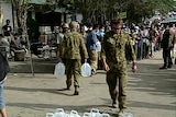 Soldiers deliver water in Banda Aceh