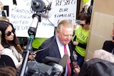 Nigel Satterley talks to reporters at the protest at State Parliament.