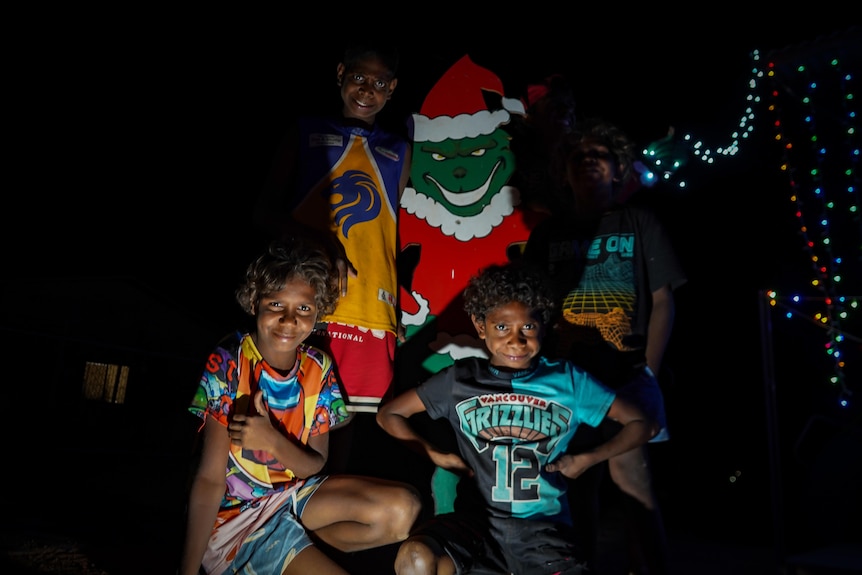Kids pose with Grinch