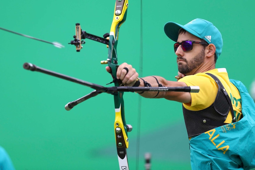 A focused Taylor Worth shoots his bow.