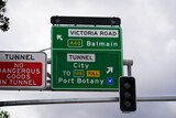 A close-up image of a road sign directing traffic in Sydney.
