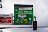 A close-up image of a road sign directing traffic in Sydney.