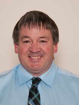 Headshot of the Kimba Mayor standing against a white wall.