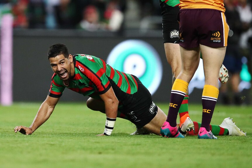 Cody Walker crawls along the ground after scoring a try to pay tribute to Greg Inglis and his goanna celebration.