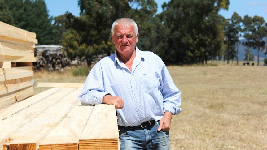 Ken Hall leaning on some timber near Scottsdale